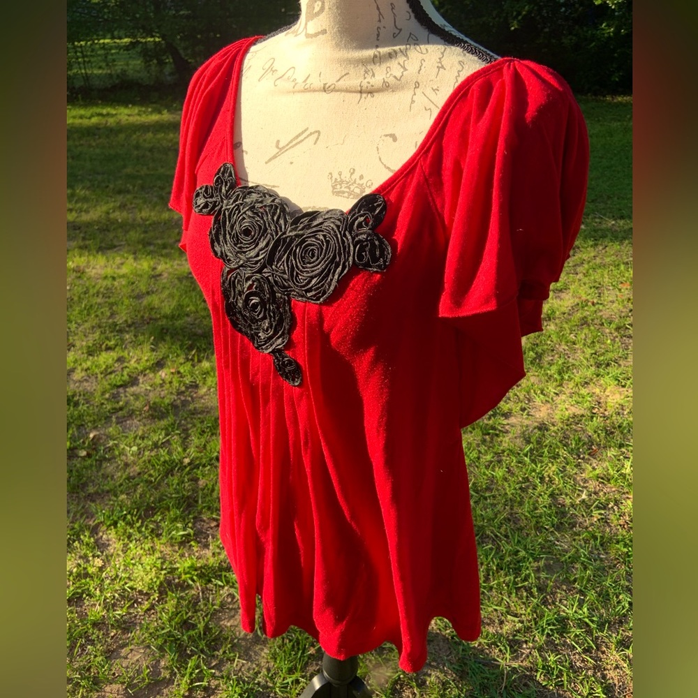Embroidered roses on red flutter sleeve blouse